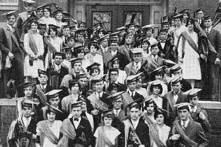 Large group of students in front of Old Main in the 1920s fashion.
